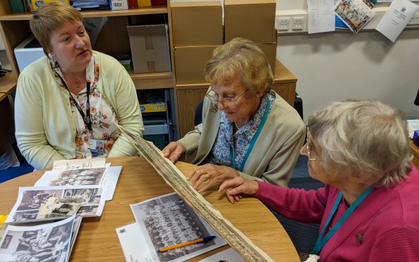 Shirley (right) and Cynthia (middle) looking at archive material with Archivist Judith Curati